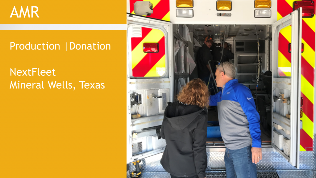 people looking inside of a ambulance