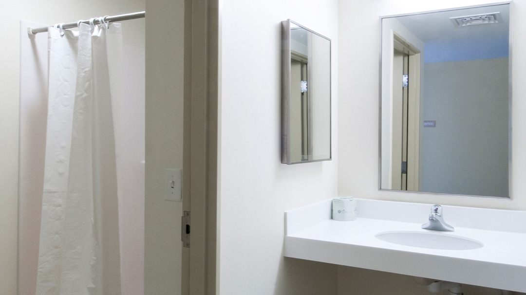 bathroom with a shower and curtain and sink
