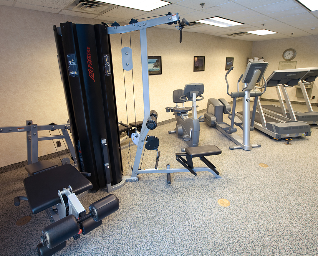 a fitness center with cardio and strength machines