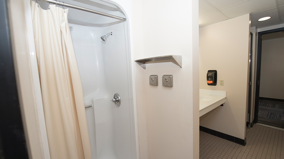 a shower and sink in a residence hall