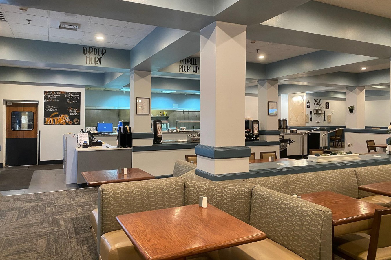 restaurant with a variety of tables, chairs, and booths