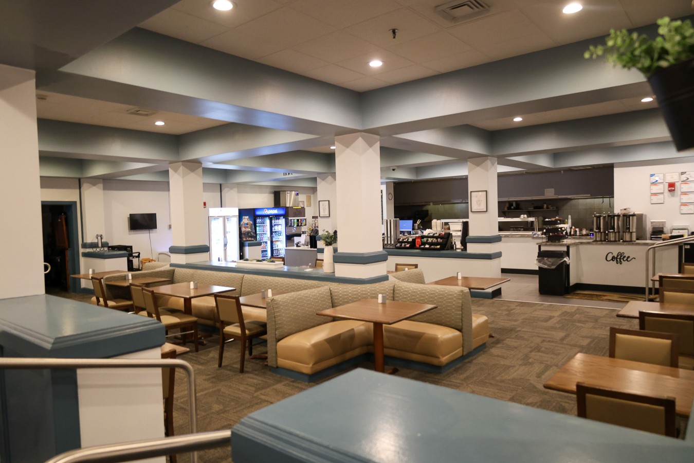 restaurant with a variety of tables, chairs, and booths