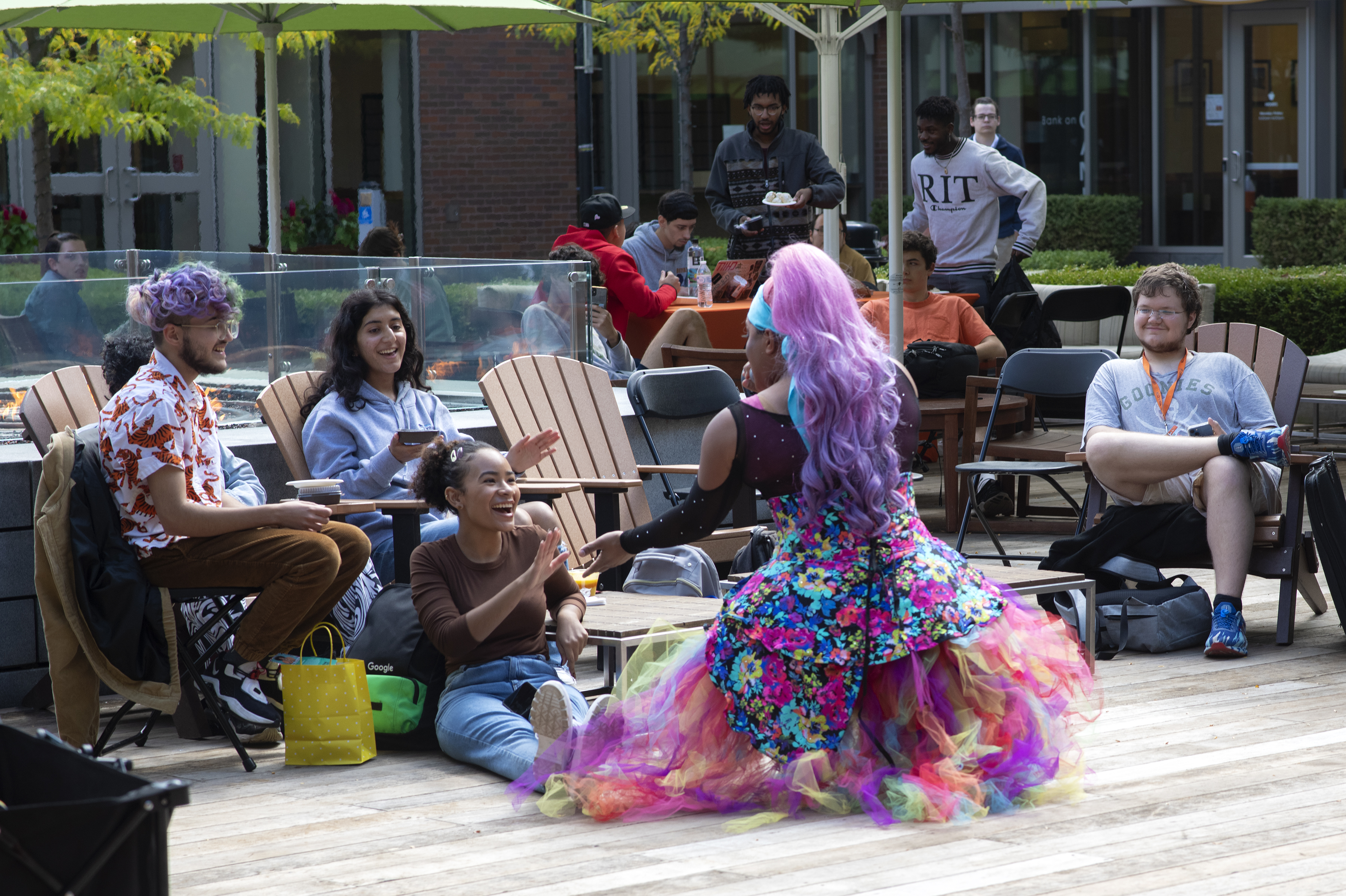 students dancing in global village plaza