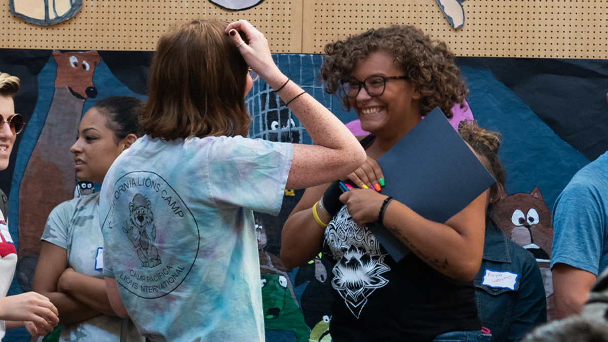 Students smiling at an ASL club