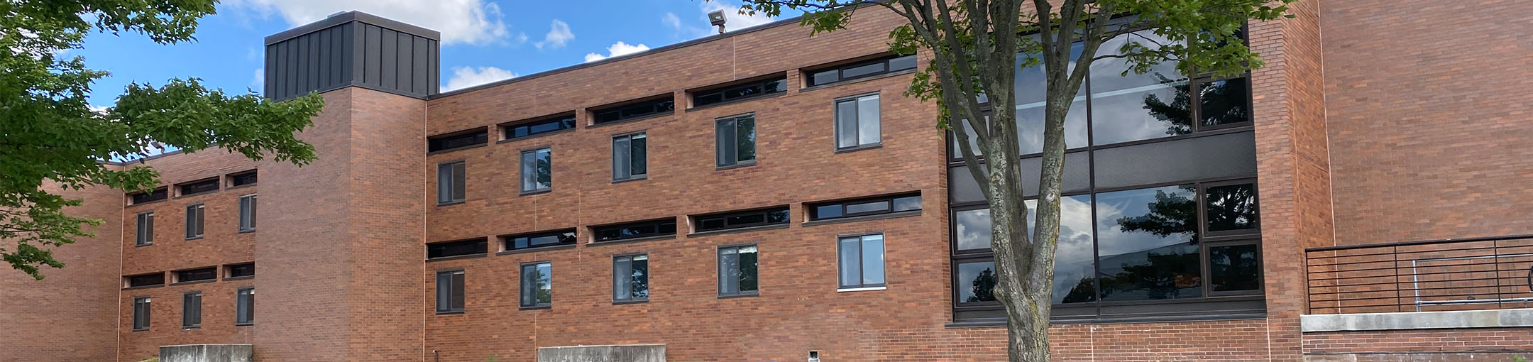 front of brick building, Residence Hall C