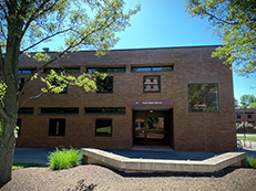 low rise brick building, front of Baker Hall