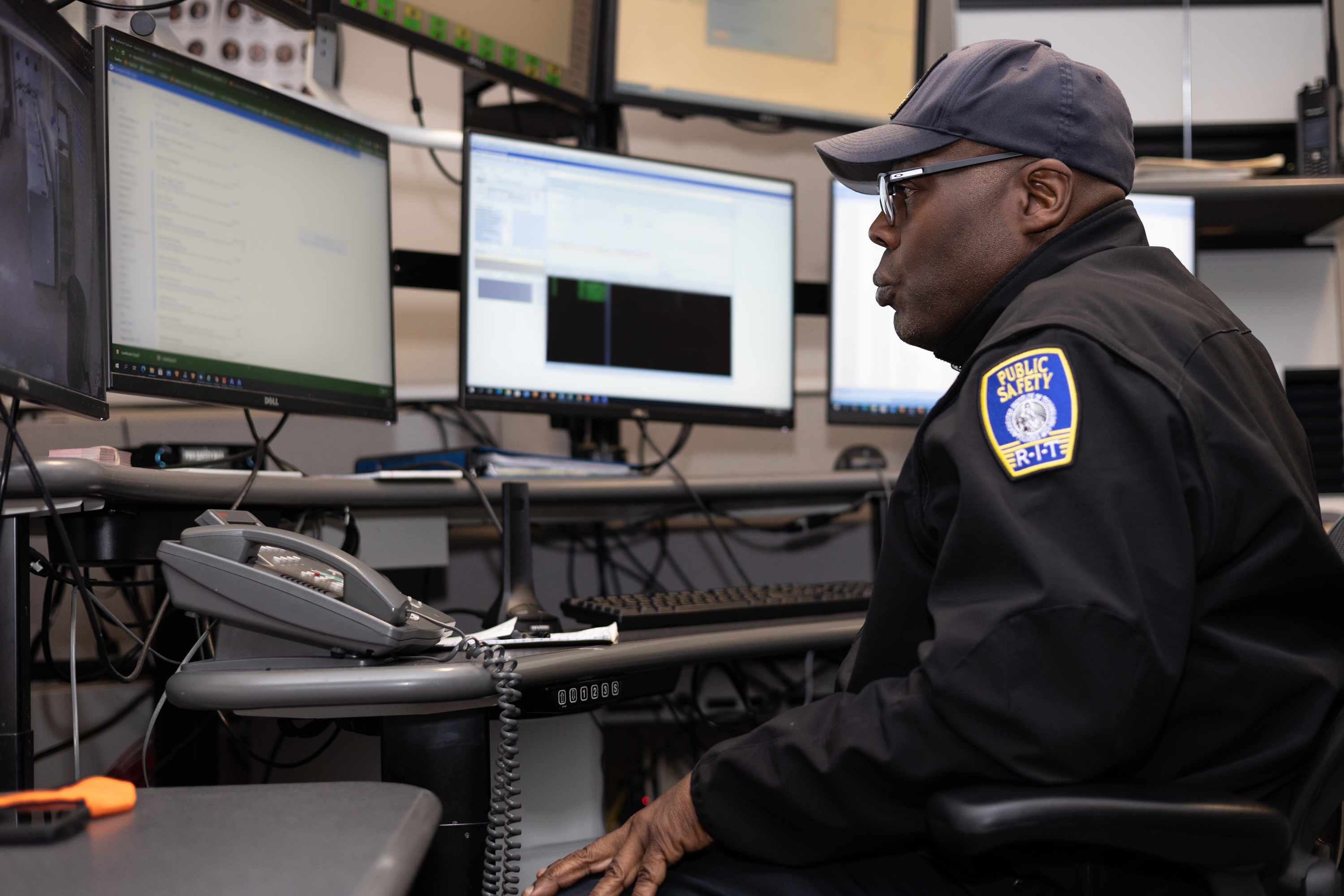 public safety officer looking at a computer screen