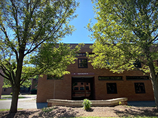 low rise brick building, front of Colby Hall