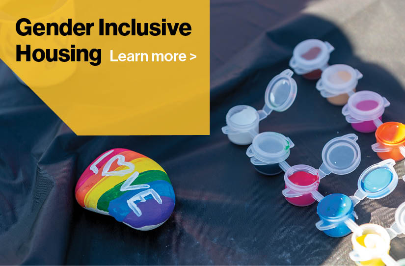 rainbow painted rock with the word LOVE on it