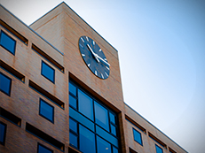 high rise brick building, front of Gleason Hall