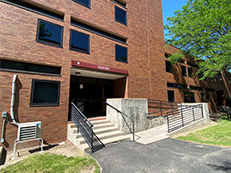 front of brick building Residence Hall B
