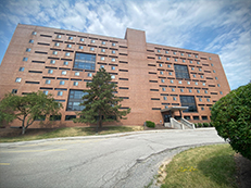 high rise brick building, front of Sol Hall