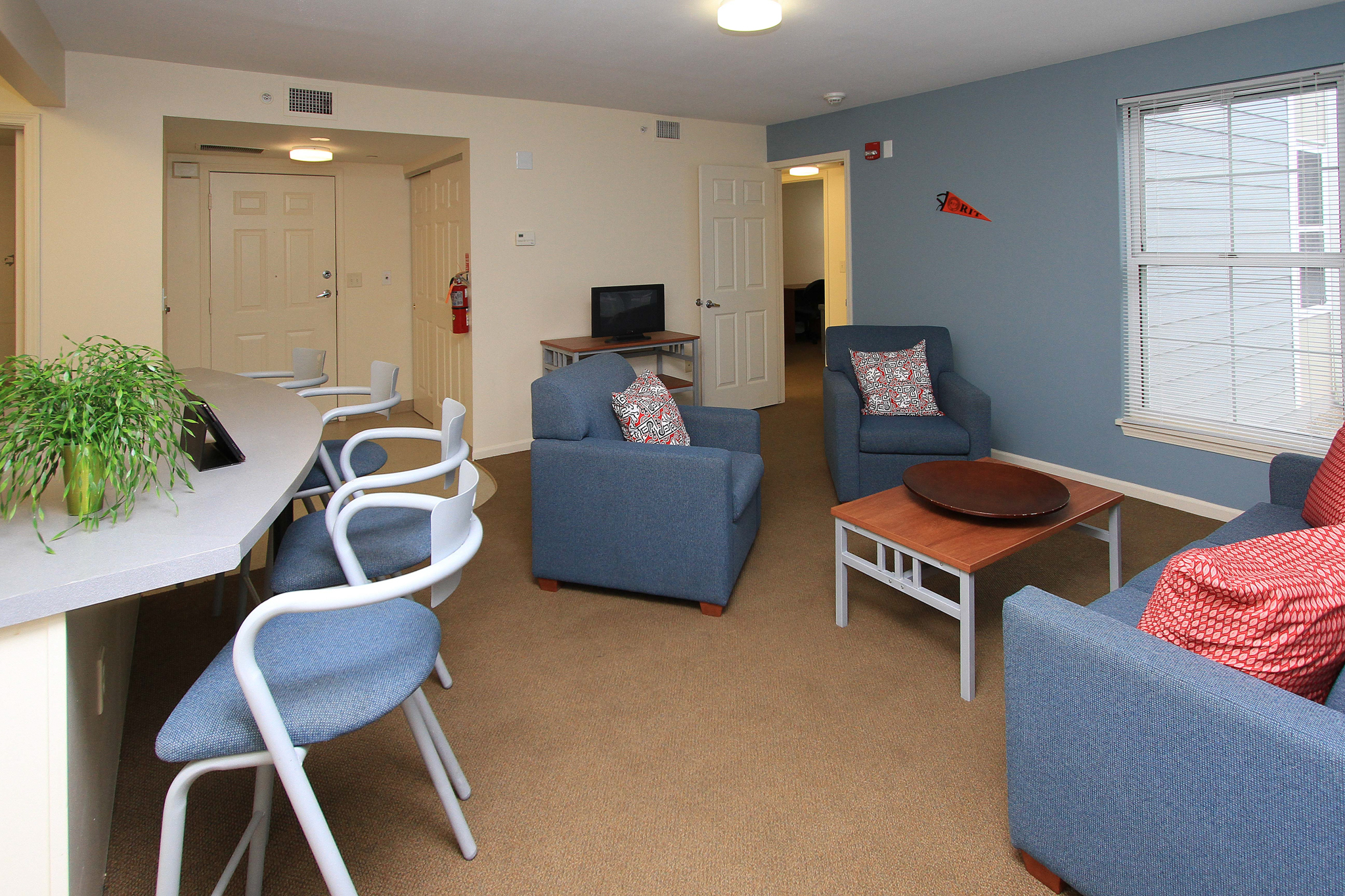 apartment with blue chairs at counter