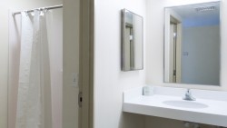 bathroom with a shower and curtain and sink