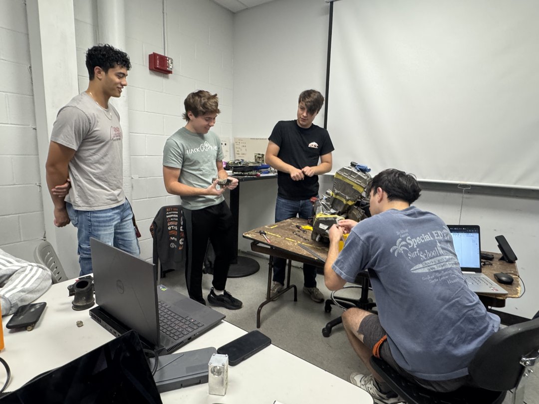 Students working on generator engine