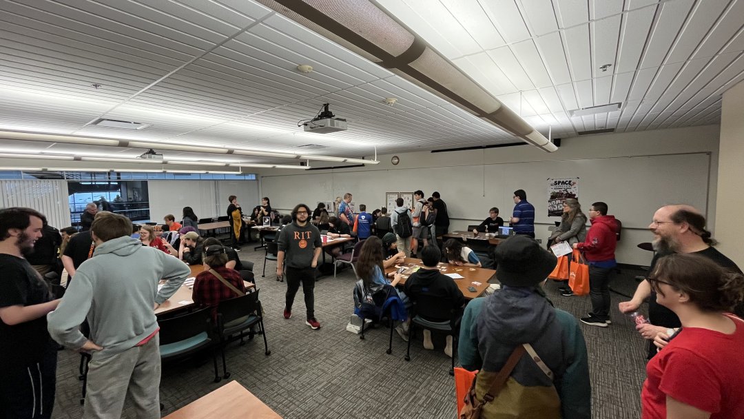 Attendees visiting exhibits for the Analog Games Showcase in 2025