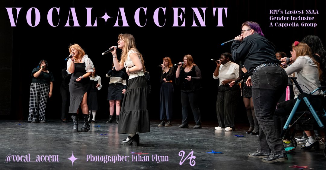 Vocal Accent, a diverse SSAA Acapella Group, performing onstage wearing black and white semi-formal attire whilst holding mics in their hand.