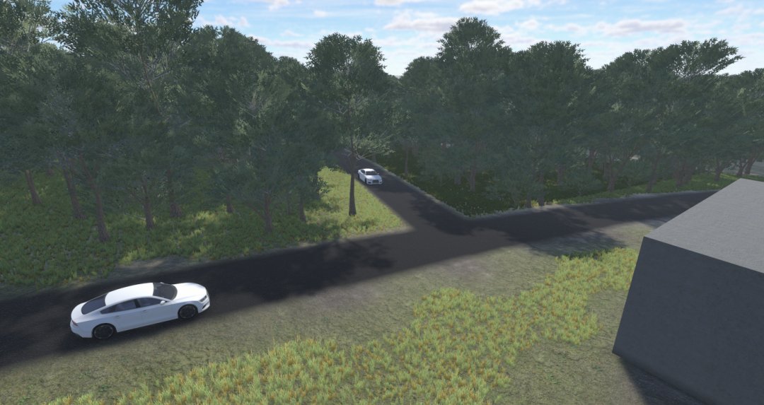 Two vehicles approaching a blind corner in our digital twin.