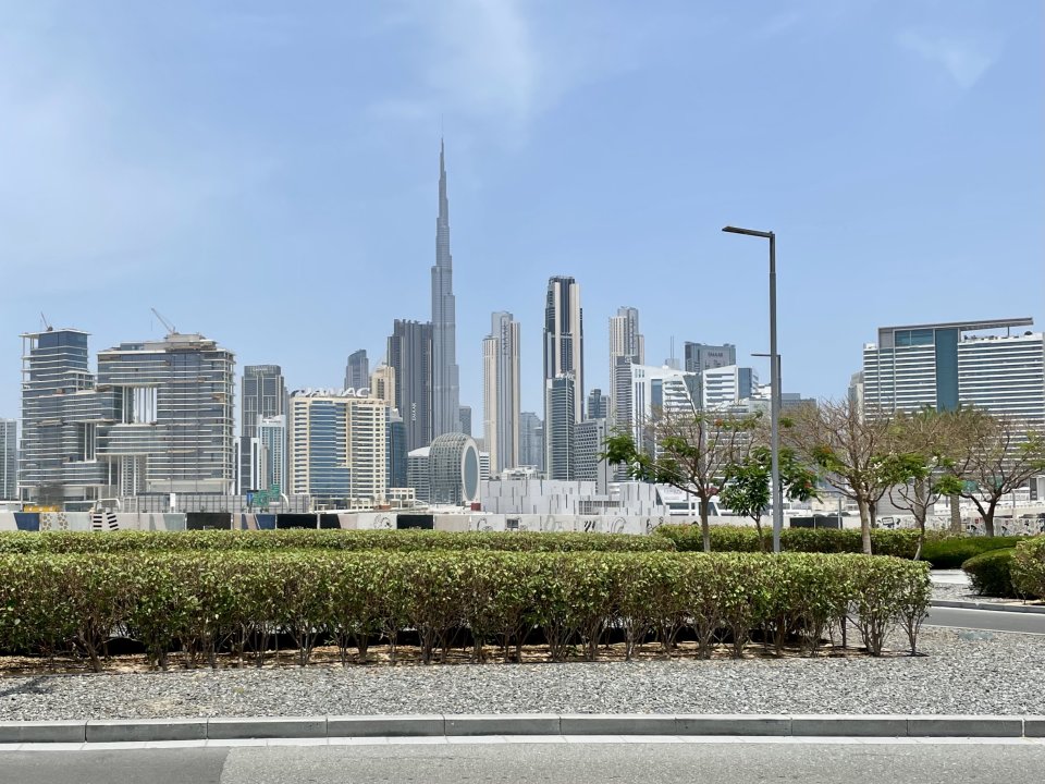 Dubai skyline against blue sky