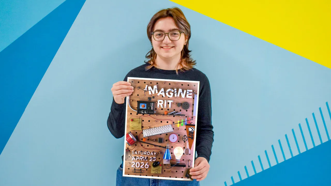 A young woman stands against a blue background, proudly holding up a poster for the Imagine RIT festival.