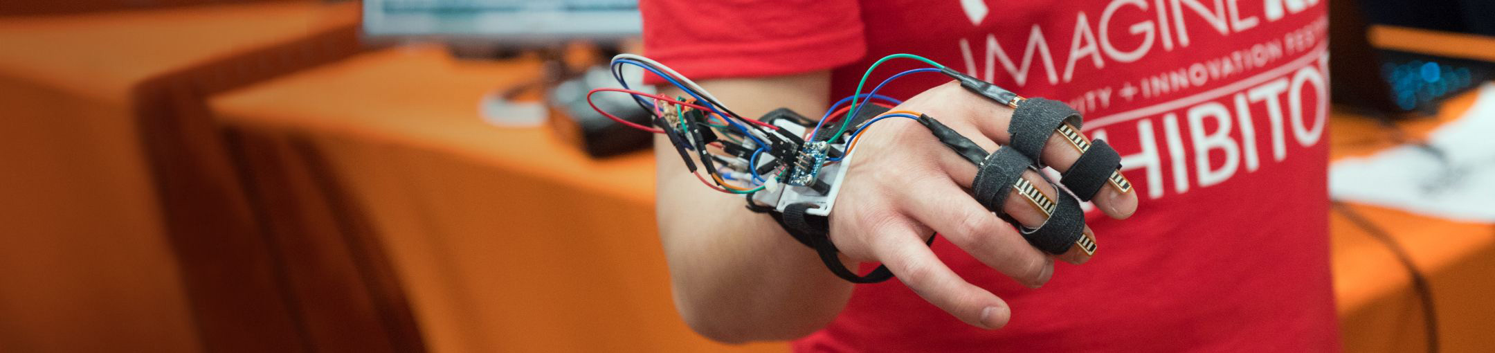 Closeup of a hand with sensors on the fingers.