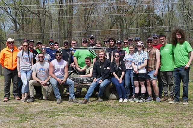 RIT's Baja race team poses for a photo with car.