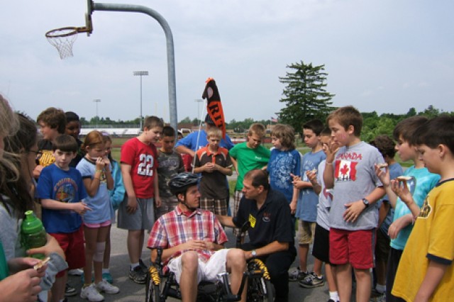 People gathered around bicyclist 