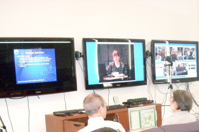 People looking at television screens