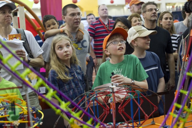 People gathered around display