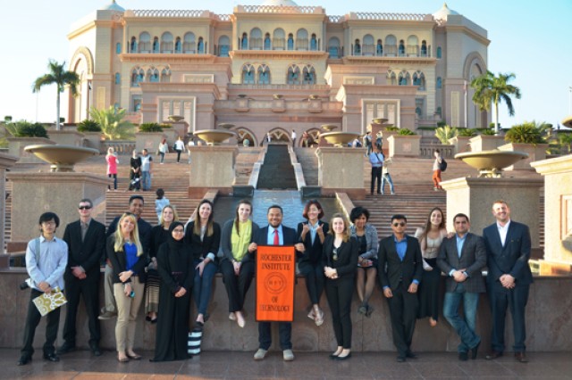 group of college students standing outside the Palace Hotel.