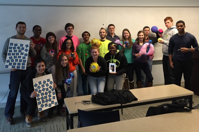 People posing infront of classroom