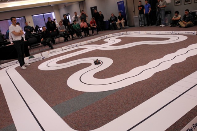 Miniature carts racing on stage