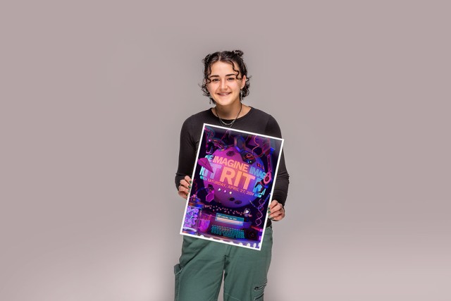 Jessica Hall holds her winning poster design for this years Imagine RIT Creativity and Innovation Festival