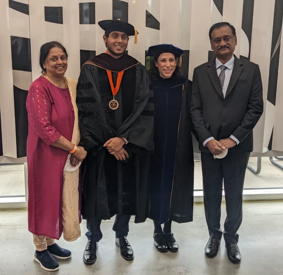 Sri with Dr. Rivero and his family at his graduation