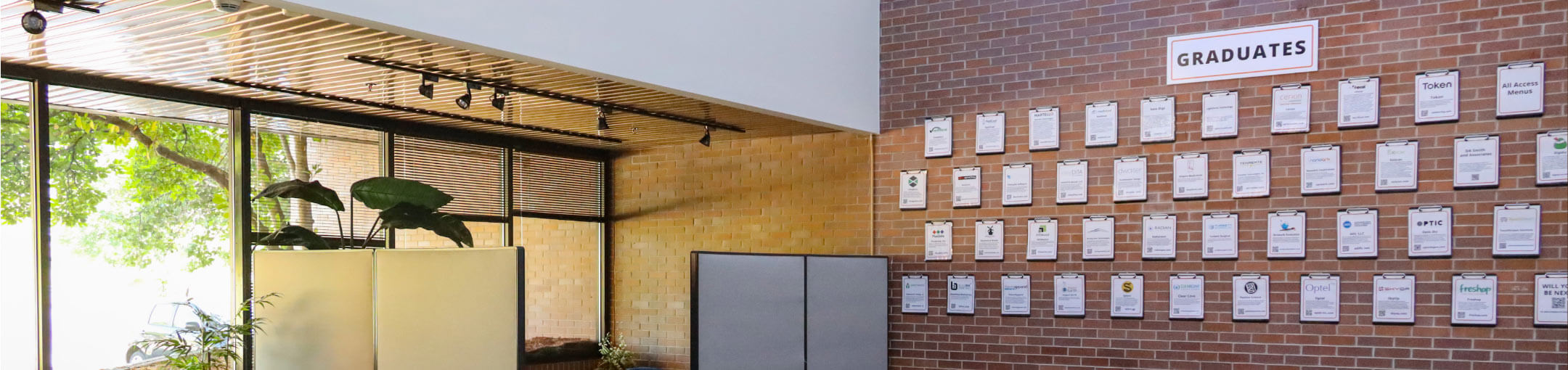 Interior view of the Venture Creations building, showing the plaques of companies that have graduated.