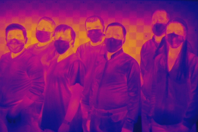 a thermal imaging photo of a team of researchers.