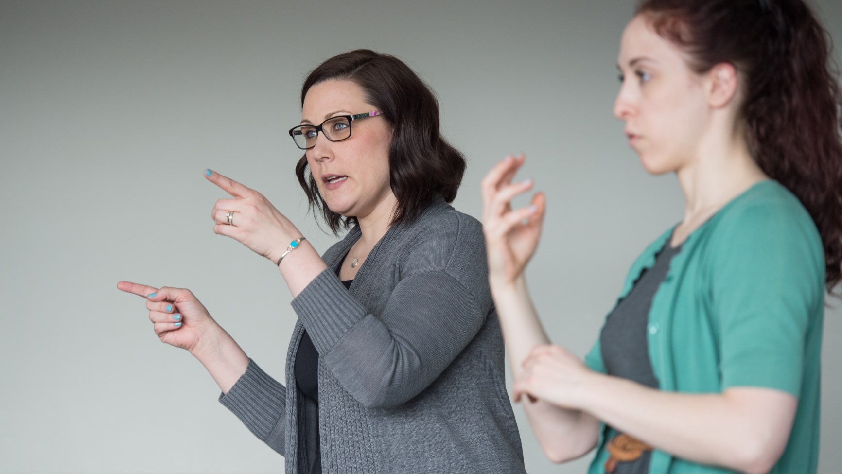 interpreters signing in a classroom