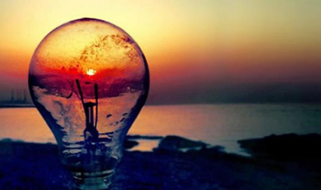 sunset viewed through a lightbulb