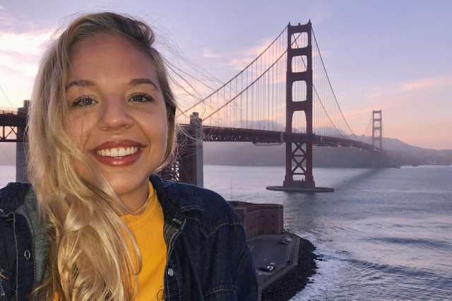 Student in front of Golden Gate Bridge.