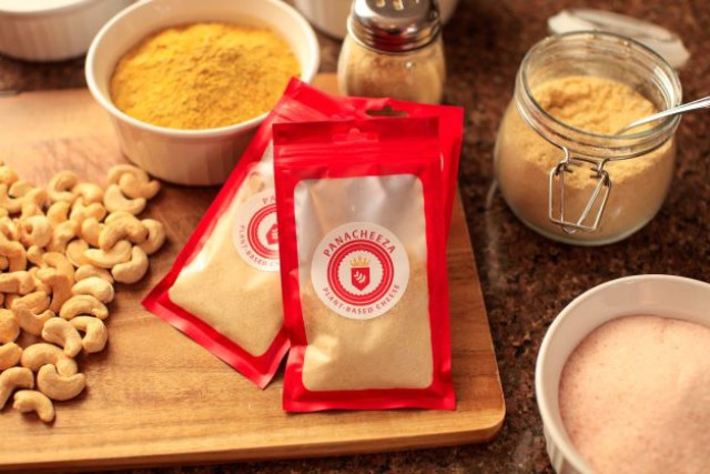 kitchen counter with several ingredients including cashews to make a plant-based cheese product.