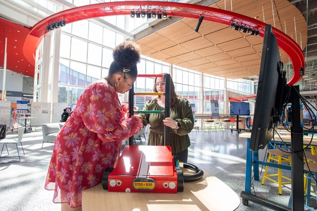 Students assemble their Bubble Machine in the R I T SHED building.