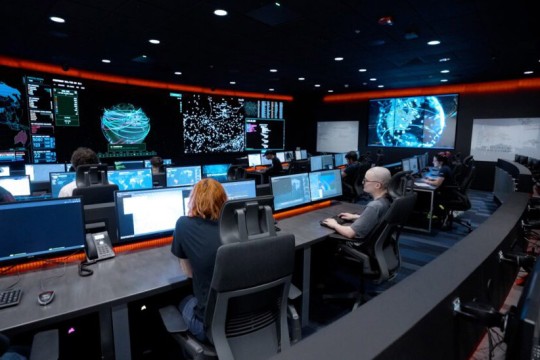 Students at R I T work at the Cyber Range, located in the E S L Global Cybersecurity Institute. 