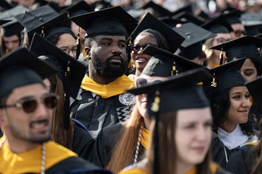 students in a crows wear commencement gear at the University of New Haven in Connecticut