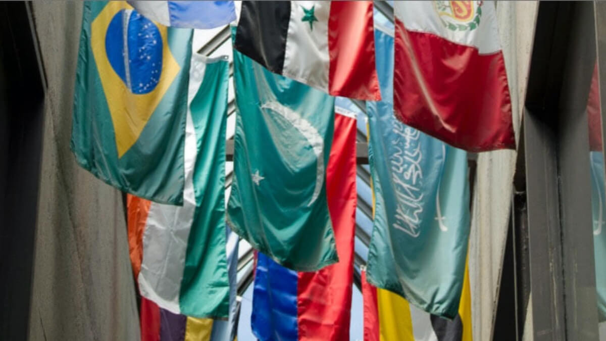 flags of various nations hanging from the ceiling.