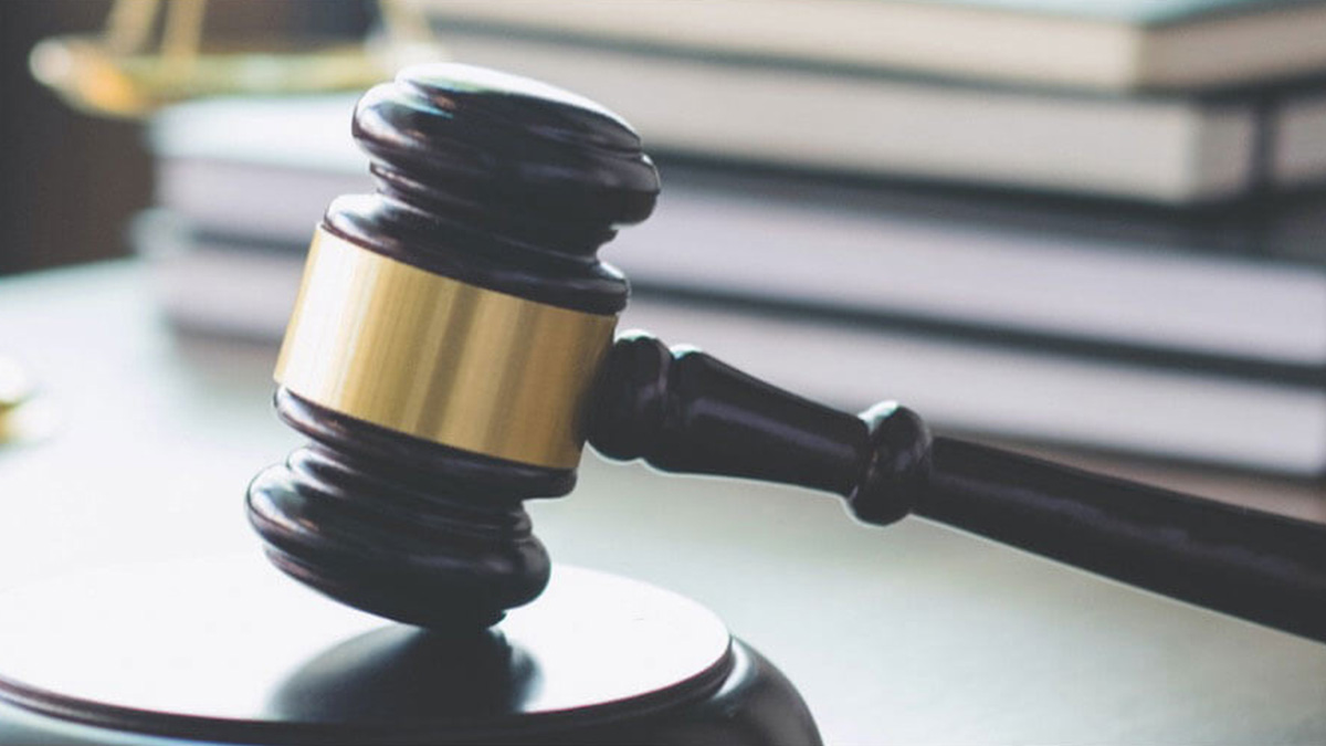 A gavel resting on a block.