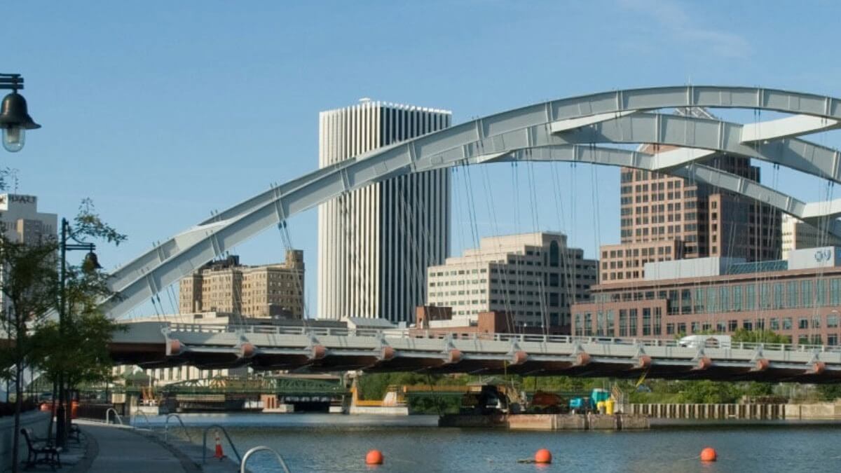 A bridge with the Rochester skyline in the background.
