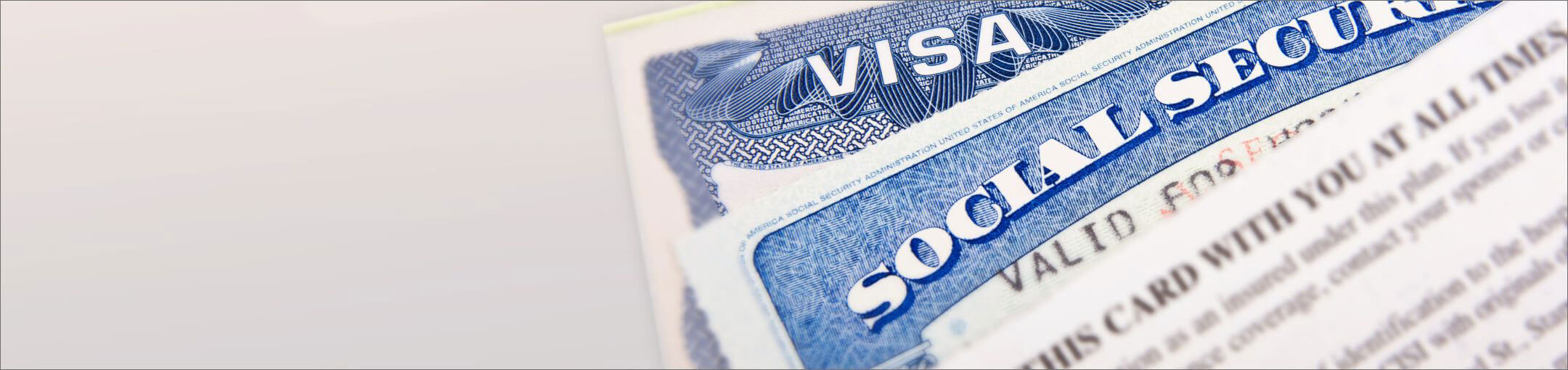 Close up of the tops of visa and social security cards.