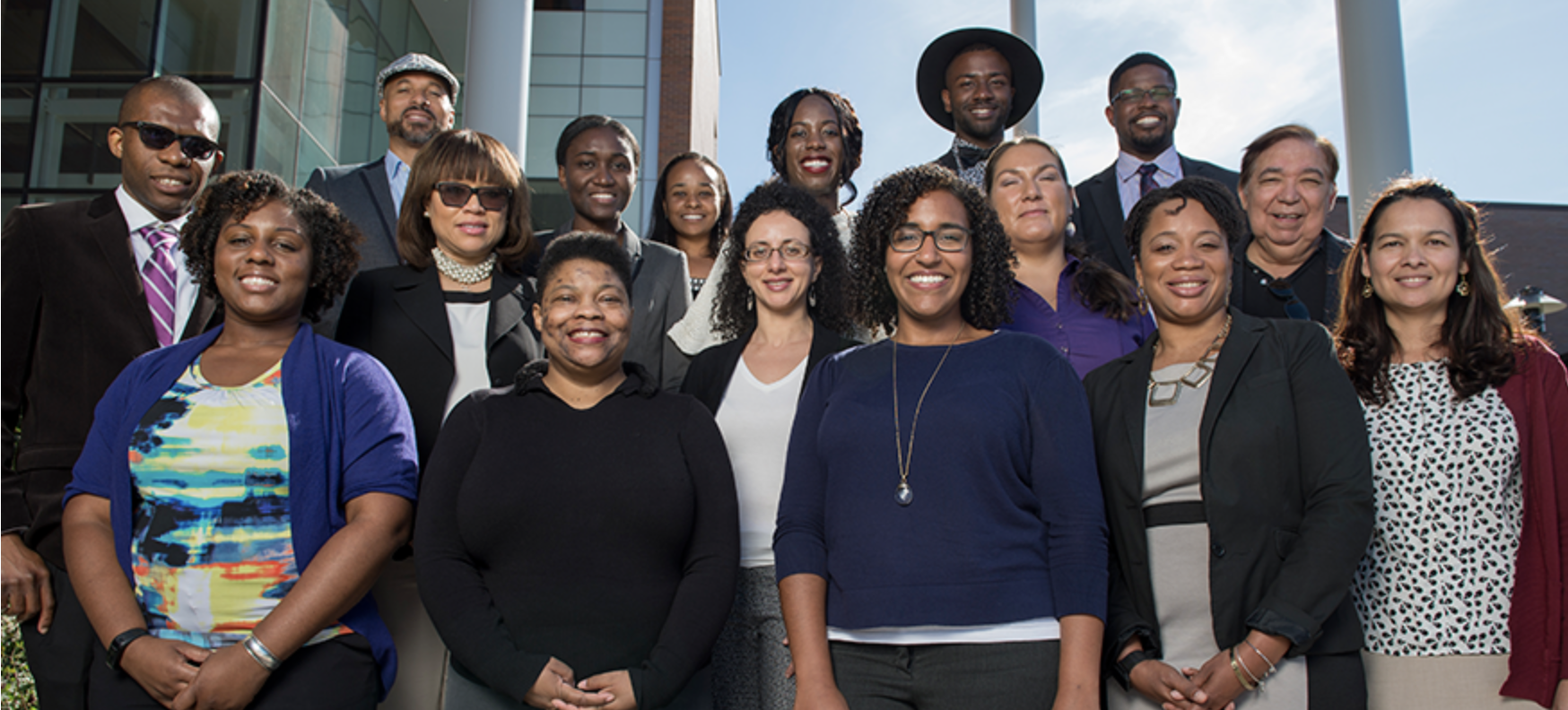 Group of RIT Faculty and Staff smiling getting there picture taken