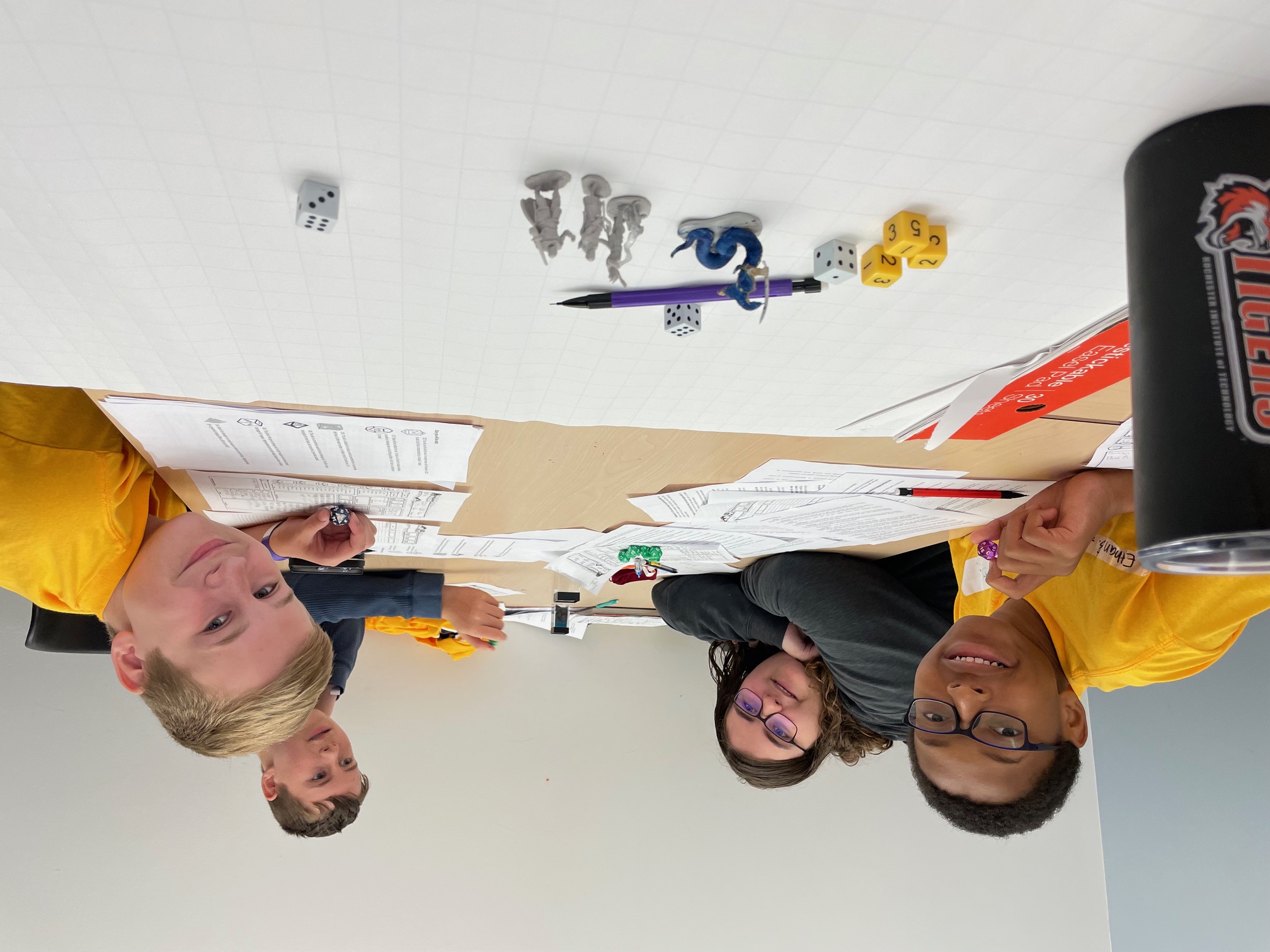 Four middle school youth playing Dungeons and Dragons.