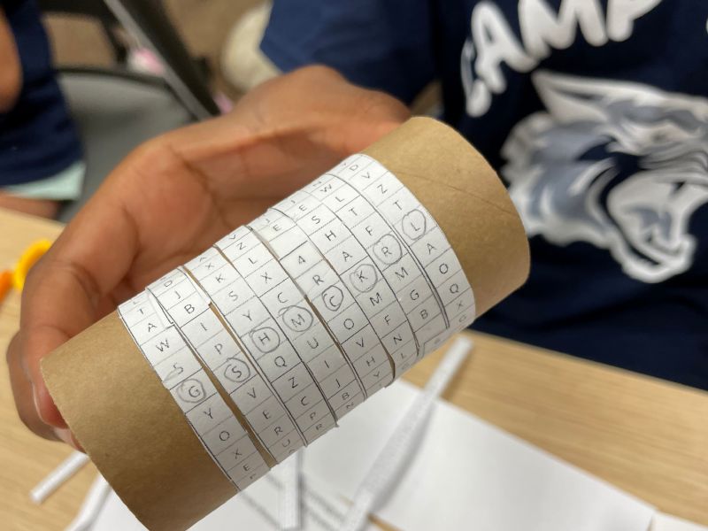 Youth made a cyphering machine with a cardboard tube.